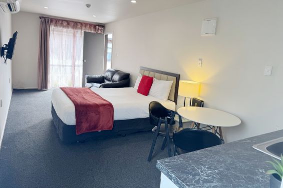 Executive Queen Studio bed and living area